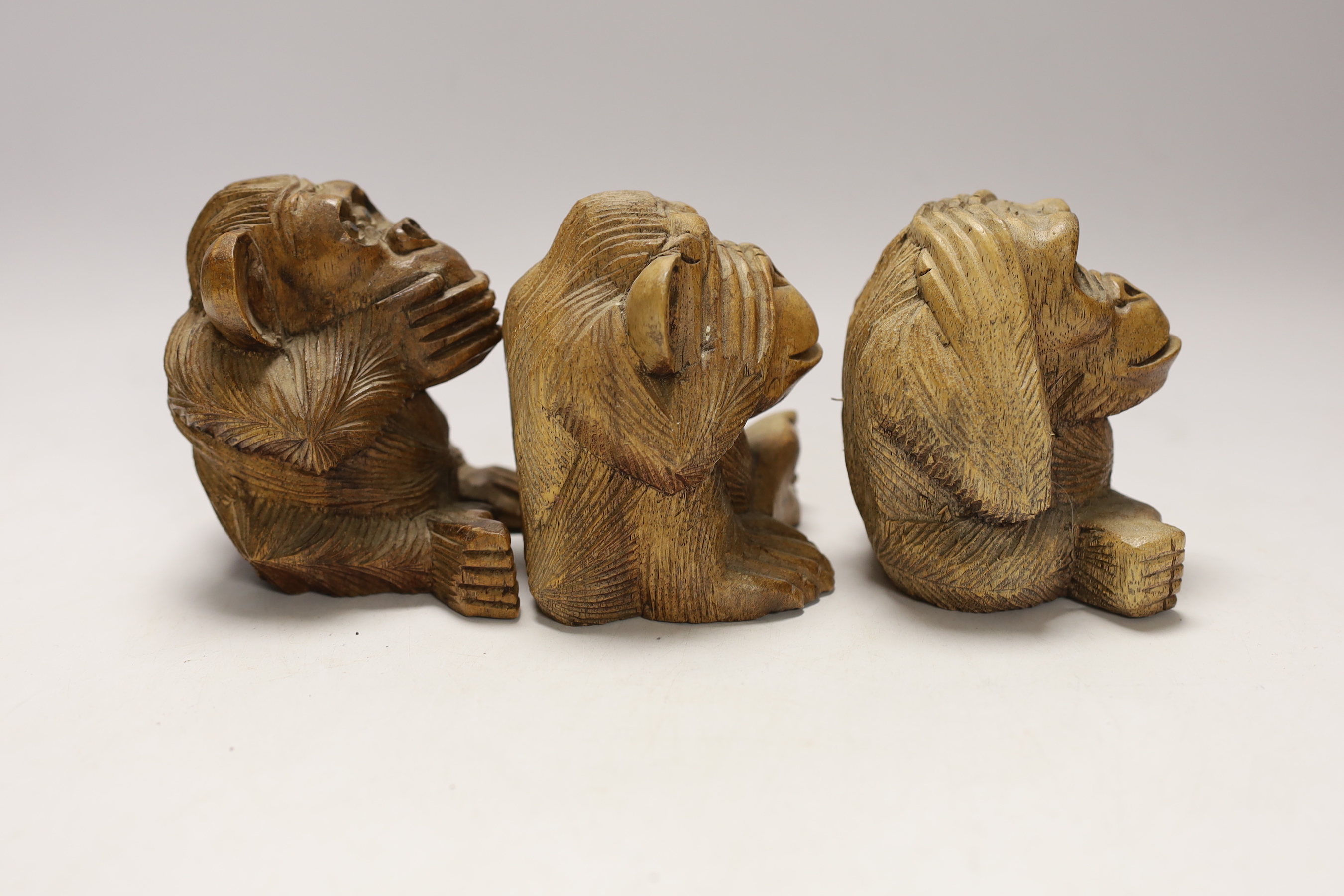Three carved wood monkeys - hear no evil, see no evil and speak no evil, 10cm tall
